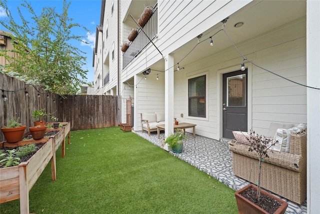 view of yard with an outdoor living space and a patio