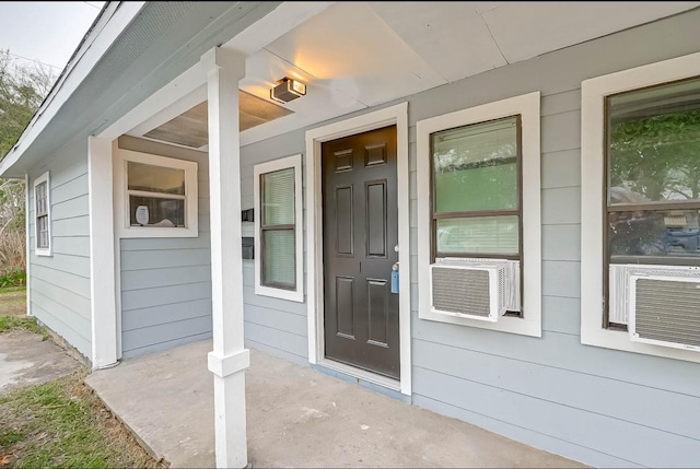 doorway to property with cooling unit