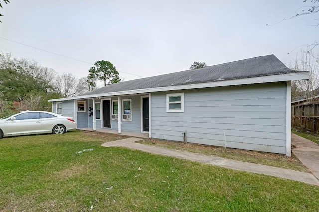 single story home featuring a porch and a front lawn