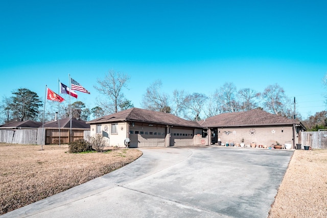 ranch-style house with a garage and a front yard