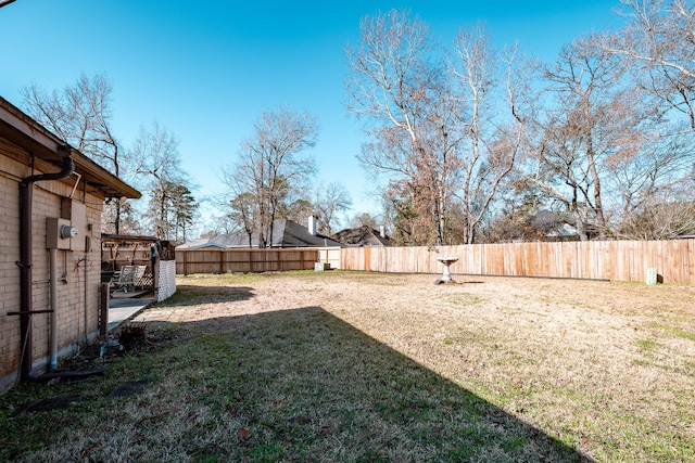 view of yard with a fenced backyard