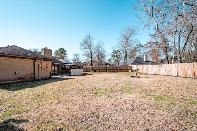 view of yard featuring a fenced backyard