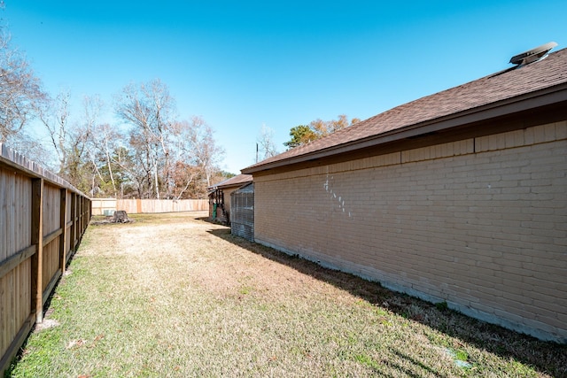 view of yard with a fenced backyard