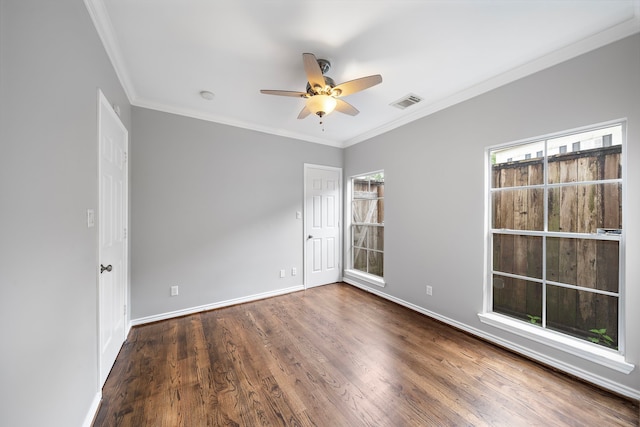 unfurnished room with ceiling fan, ornamental molding, and dark hardwood / wood-style floors