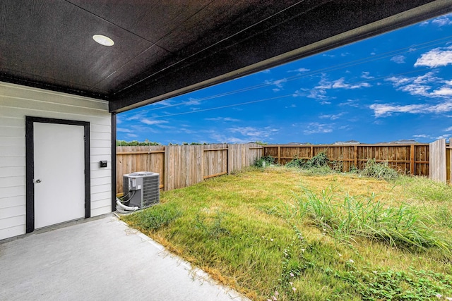 view of yard featuring central air condition unit