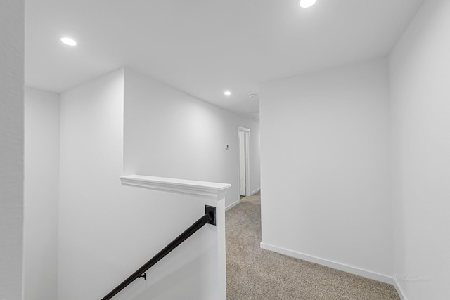 corridor with light colored carpet