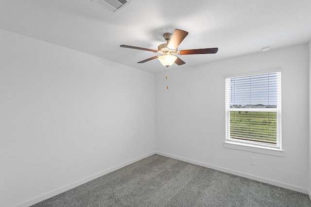 empty room featuring ceiling fan and carpet flooring