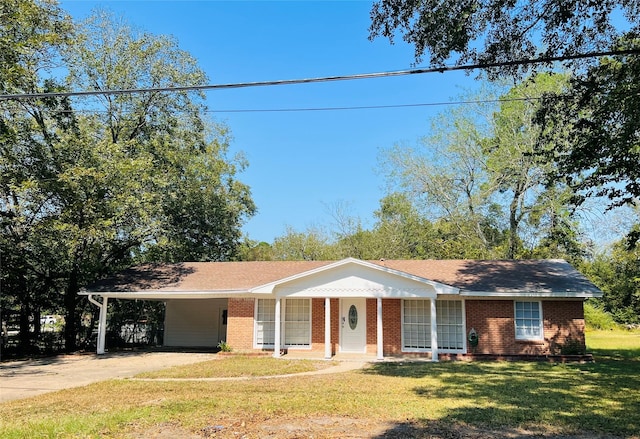 ranch-style home with a carport, a porch, and a front yard