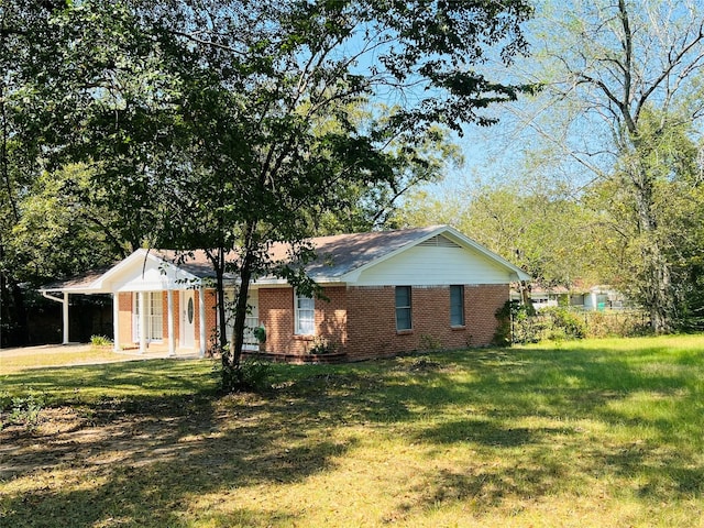 view of property exterior featuring a carport and a lawn