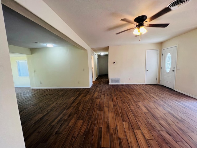 interior space featuring ceiling fan and dark hardwood / wood-style floors