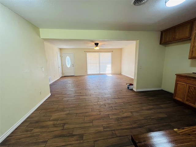 interior space featuring dark hardwood / wood-style floors and ceiling fan