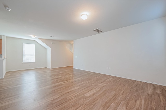 spare room with light wood-type flooring