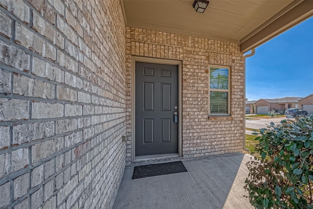 entrance to property with brick siding