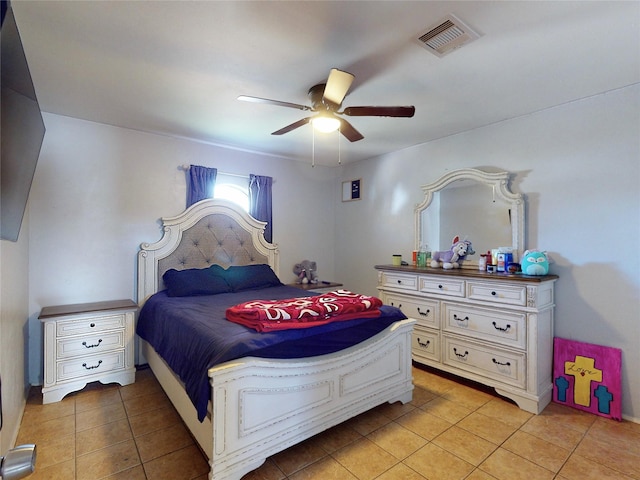 tiled bedroom with ceiling fan