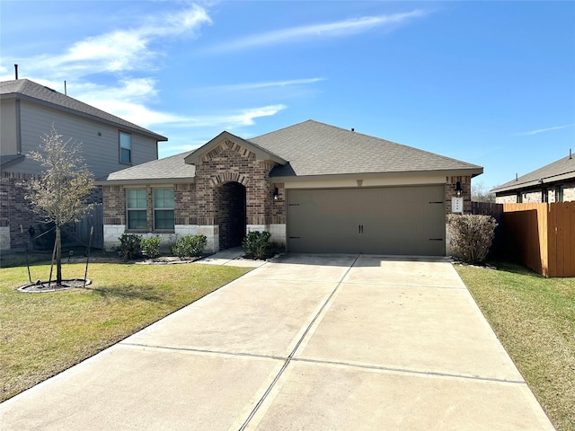 view of front of house with a garage and a front yard