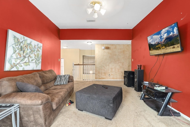 living room with ceiling fan and carpet floors