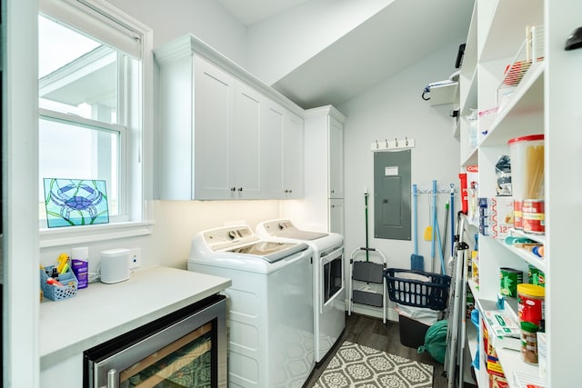 laundry room with washing machine and clothes dryer, cabinets, dark hardwood / wood-style floors, electric panel, and beverage cooler