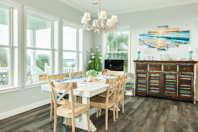 dining room with crown molding, dark wood-type flooring, and a notable chandelier