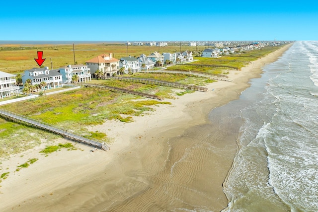 bird's eye view with a view of the beach and a water view