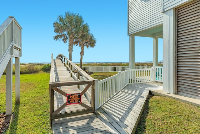 wooden terrace with a yard