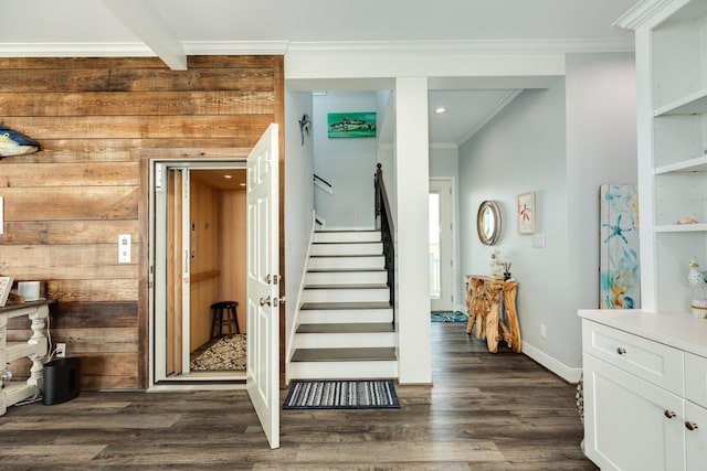 stairway featuring crown molding, wooden walls, hardwood / wood-style floors, and beamed ceiling