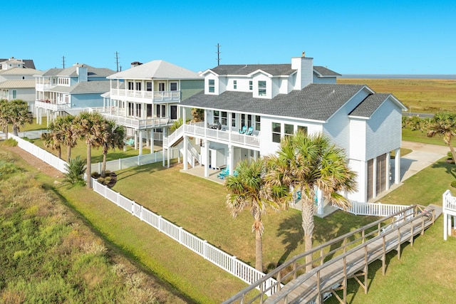 rear view of property with a balcony