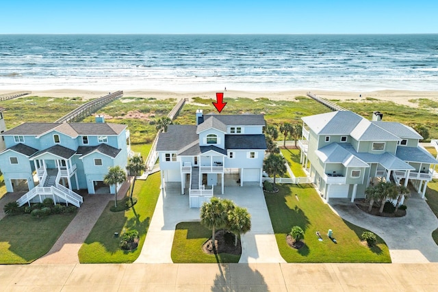 aerial view featuring a water view and a beach view