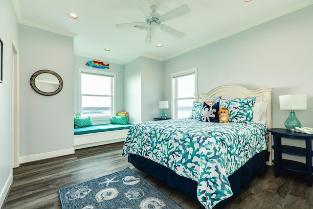 bedroom featuring crown molding, dark wood-type flooring, and ceiling fan