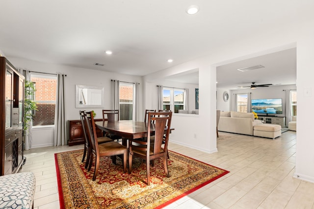 dining space featuring a wealth of natural light and ceiling fan