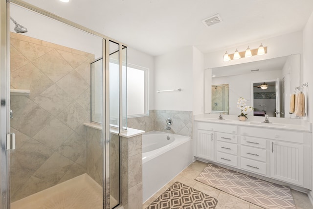 bathroom with tile patterned flooring, plus walk in shower, and vanity