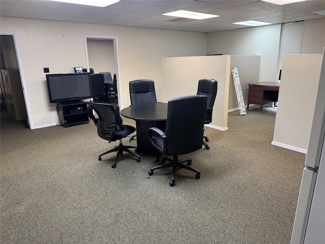 carpeted office space with a drop ceiling