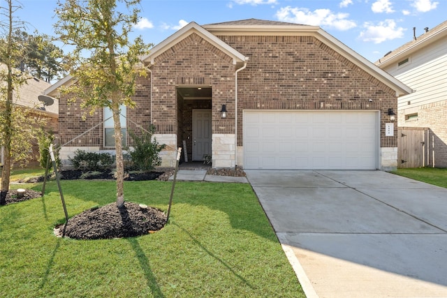 front of property featuring a garage and a front lawn