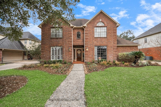 view of front property featuring cooling unit and a front lawn