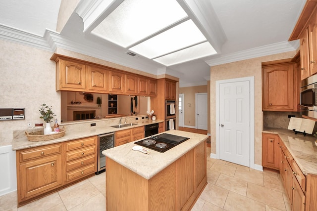 kitchen featuring wine cooler, crown molding, black appliances, and a kitchen island