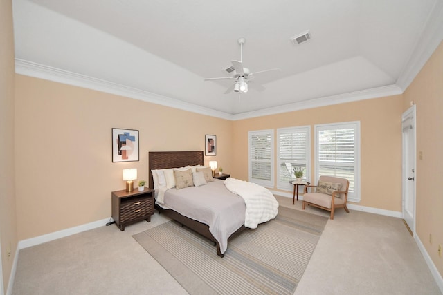 bedroom with a raised ceiling, crown molding, light carpet, and ceiling fan