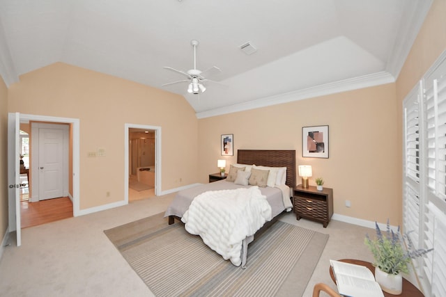 carpeted bedroom with crown molding, lofted ceiling, and ceiling fan