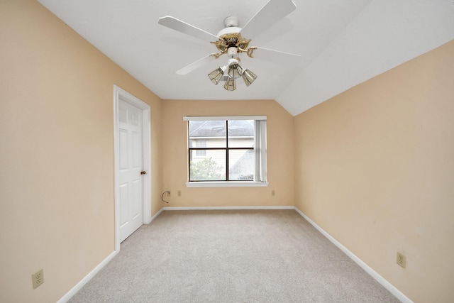 interior space with vaulted ceiling and ceiling fan