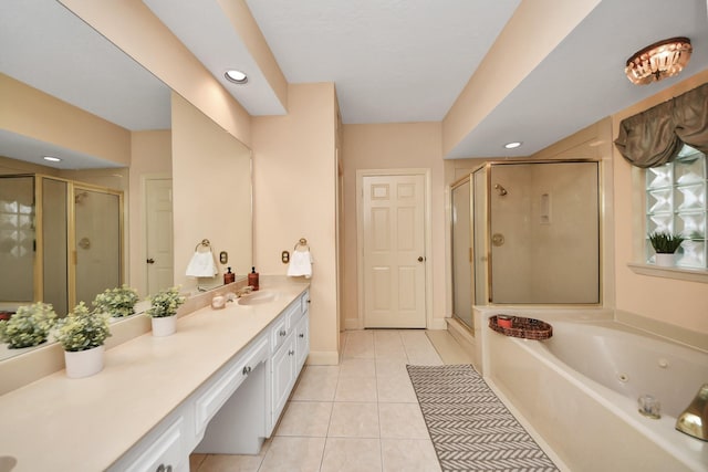 bathroom with tile patterned flooring, vanity, and independent shower and bath