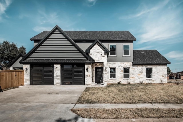 view of front of property with a garage and a front yard