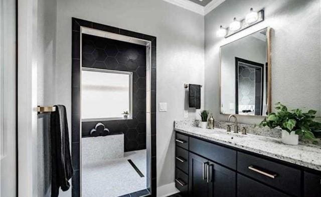 bathroom with vanity and crown molding