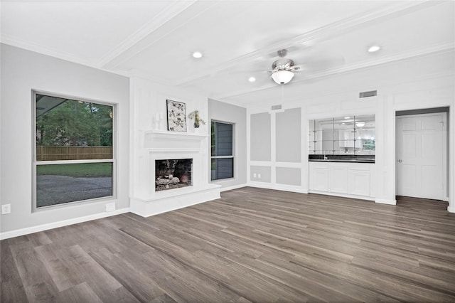 unfurnished living room featuring beamed ceiling, ceiling fan, ornamental molding, and dark hardwood / wood-style floors