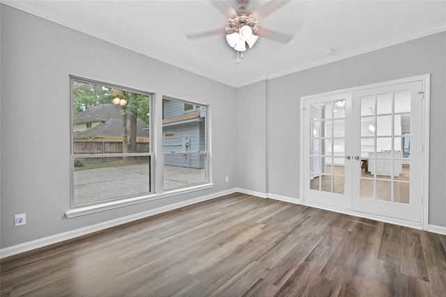 unfurnished room with ceiling fan, ornamental molding, and wood-type flooring