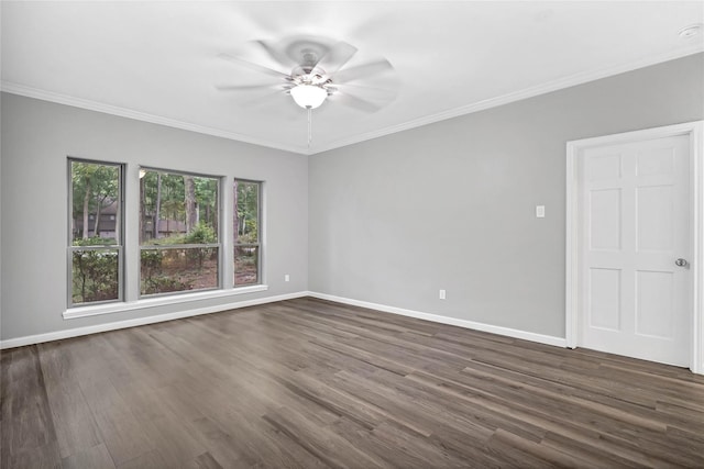 unfurnished room featuring dark wood-type flooring, ceiling fan, and crown molding