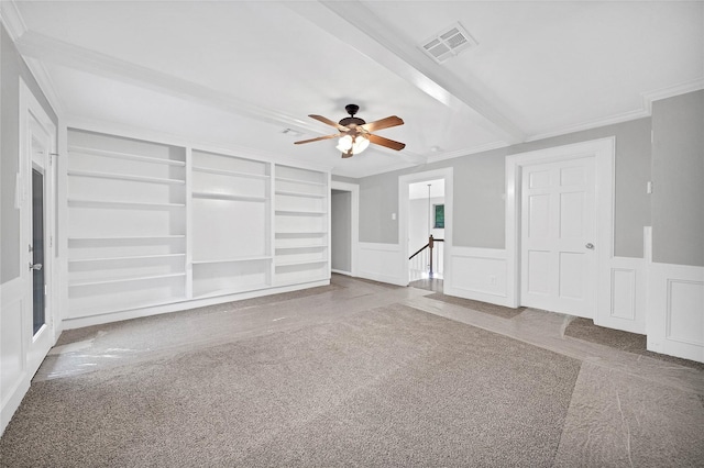 unfurnished living room featuring crown molding, built in features, ceiling fan, and carpet