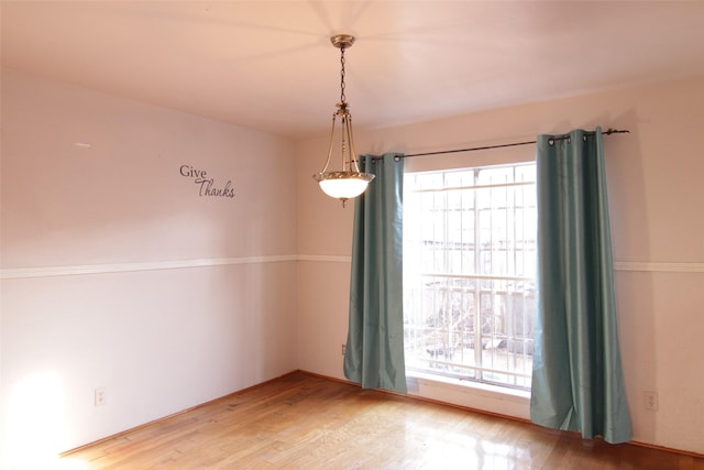 empty room with wood-type flooring