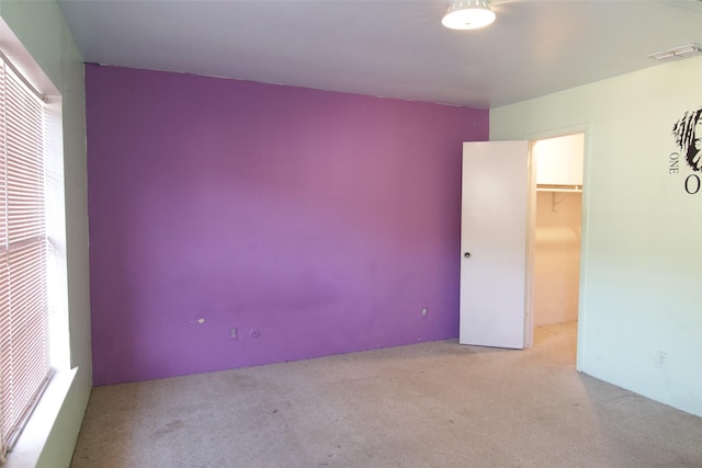 empty room with light colored carpet