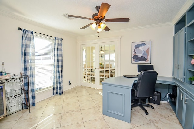 tiled office with ceiling fan, ornamental molding, a textured ceiling, and a wealth of natural light