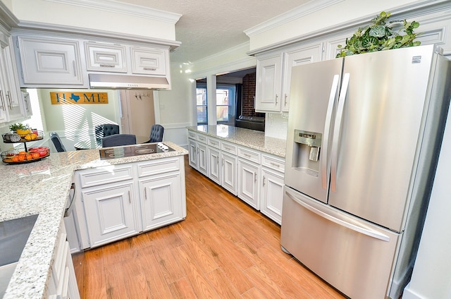 kitchen featuring light hardwood / wood-style flooring, white cabinetry, light stone counters, ornamental molding, and stainless steel fridge with ice dispenser