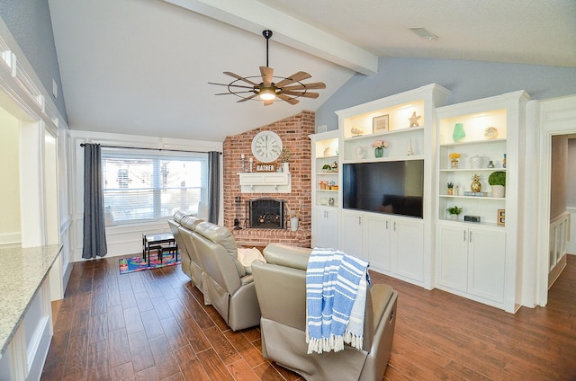 living room featuring dark hardwood / wood-style flooring, a brick fireplace, vaulted ceiling with beams, and ceiling fan