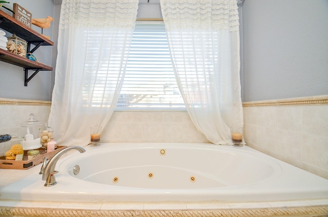 bathroom with a relaxing tiled tub